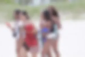 Ebony girl with huge boobs in tiny bikini in Florida