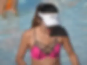 Asian milf in black and pink bikini at the beach