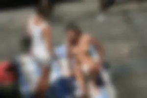 Two teens stripping and going topless to tan
