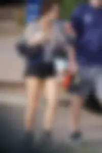 Cutie walking her dog in short denim shorts and showing a bit of cheek