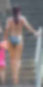 Sexy brunette milf in a bikini with a great body, nice ass and some camel toe