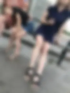 Very cute teen candid girl in a dress sitting on a bus stop creepshots