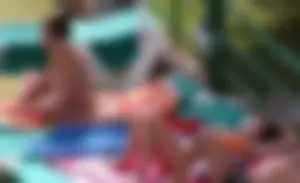 Sexy pool teen with big boobs barely staying in her top