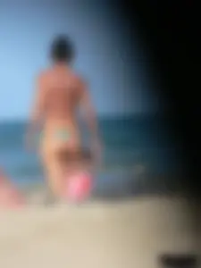 Bunch of sexy babes on the beach topless and in thong bikinis
