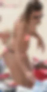 Girl in peach bikini on the beach with a great body and great ass
