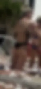 Hot babes in bikinis by pool
