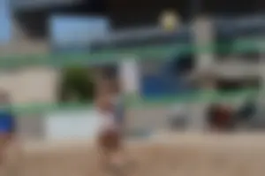 Beach volleyball blonde looking sexy and showing her body off