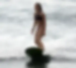 Beautiful hot surfer babe in bikini with a great ass