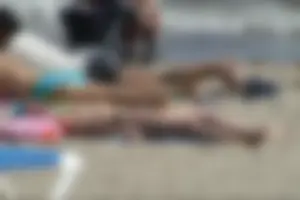 Girls on a nude beach in Sitges, Spain