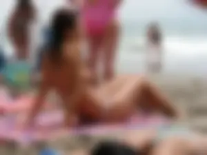 Hot topless girl on the beach in a thong bikini with a nice ass