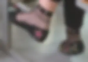 College teen girl's feet in flats and seethrough sock closeup in classroom