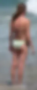 Milf at the beach in the water with hard nipples and a nice body