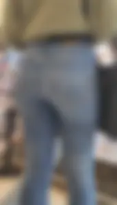Girl wearing tight blue jeans at the store, closeups of her hot ass
