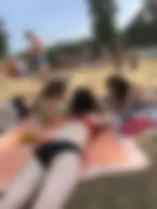 Pale Girl in Swimsuit Lying on a Lake Beach With Her Friends Creepshots Gallery