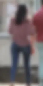 Brunette walking with her boyfriend in tight jeans