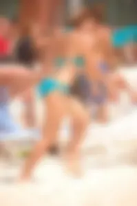 Assortment of sexy babes at the beach in bikinis