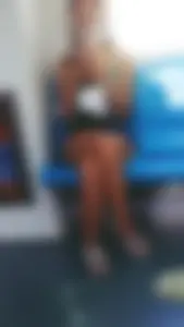 Bus Creepshot of a Candid Girl in Shorts Sitting With Crossed Legs