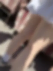 Closeups of a hot girl’s pale legs, she’s wearing a skirt