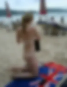 Micro thong blonde on the beach with pokies and camel toe