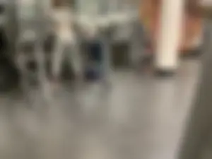 Hot gym babe in grey leggings with a nice ass doing squats