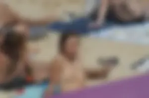 Topless girls on a beach in Barcelona