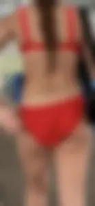 Beauty picks at her bikini wedgie
