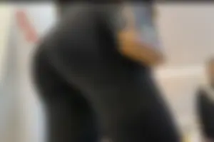 Latina shaking her ass in line