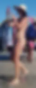 Cute girl on the beach with a decent body in thong bikini