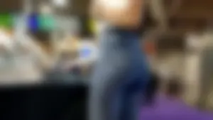 Jewelry vendor in light blue jeans