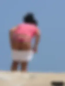 A bunch of hot babes on the beach in thong bikinis