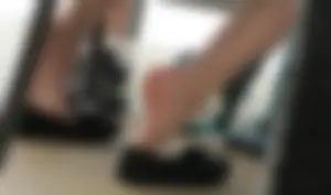 Female Feet With Flats Taken Off Under Table - Photos From College Classroom