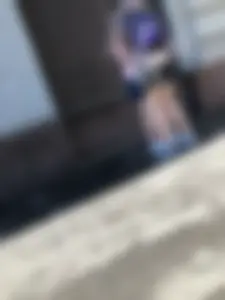 Skinny Girl in a Skirt Walking Down the Street and Hugging Her Friend Candid