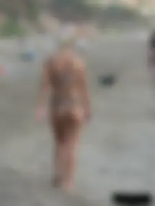 Tattooed blonde with big tits topless and in thong