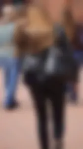 Pretty girl walking in tight black pants