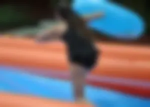 Beautiful brunette tube girl in black bikini