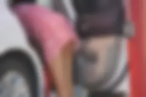Sexy blonde upskirted in pink dress while cleaning her car