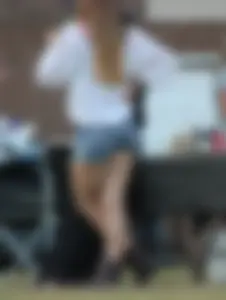 Hippie type dressed girl in denim shorts with a nice ass