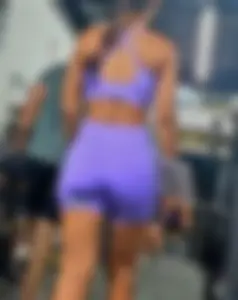 Girl in lilac short leggings at the gym