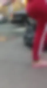 Hot Round Booty in Red Pants Street Closeup