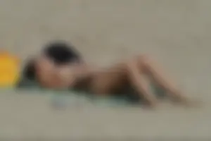 Girls on a nude beach in Sitges, Spain