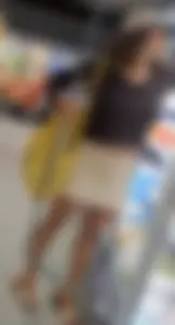Curly haired woman with huge tits and nice legs