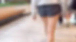 Asian girl in tight black shorts at the mall