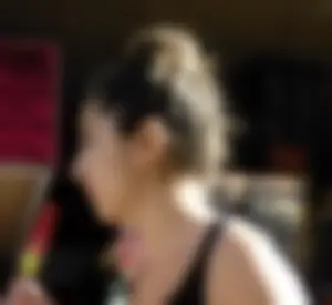 Brunette ass cheeks in short yellow shorts