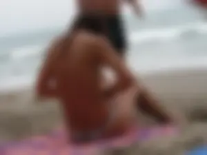 Hot topless girl on the beach in a thong bikini with a nice ass