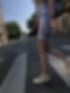 Cute candid girl in tight shorts on a crosswalk