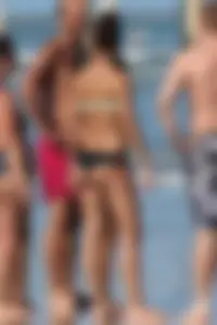 Beach girl out in a bikini with a nice round big booty