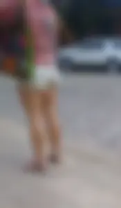 Leggy girl in shorts sitting