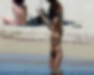 Small boobed topless milf on the beach