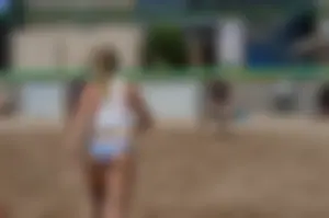 Beach volleyball blonde looking sexy and showing her body off