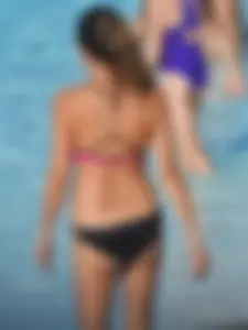 Asian milf in black and pink bikini at the beach